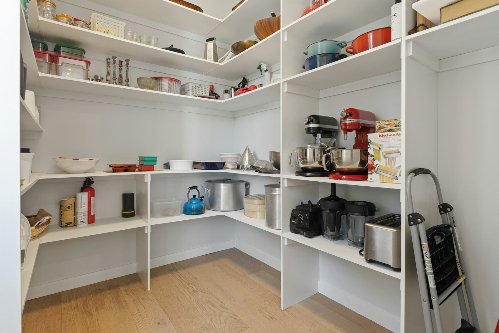 Corner pantry with white adjustable shelving