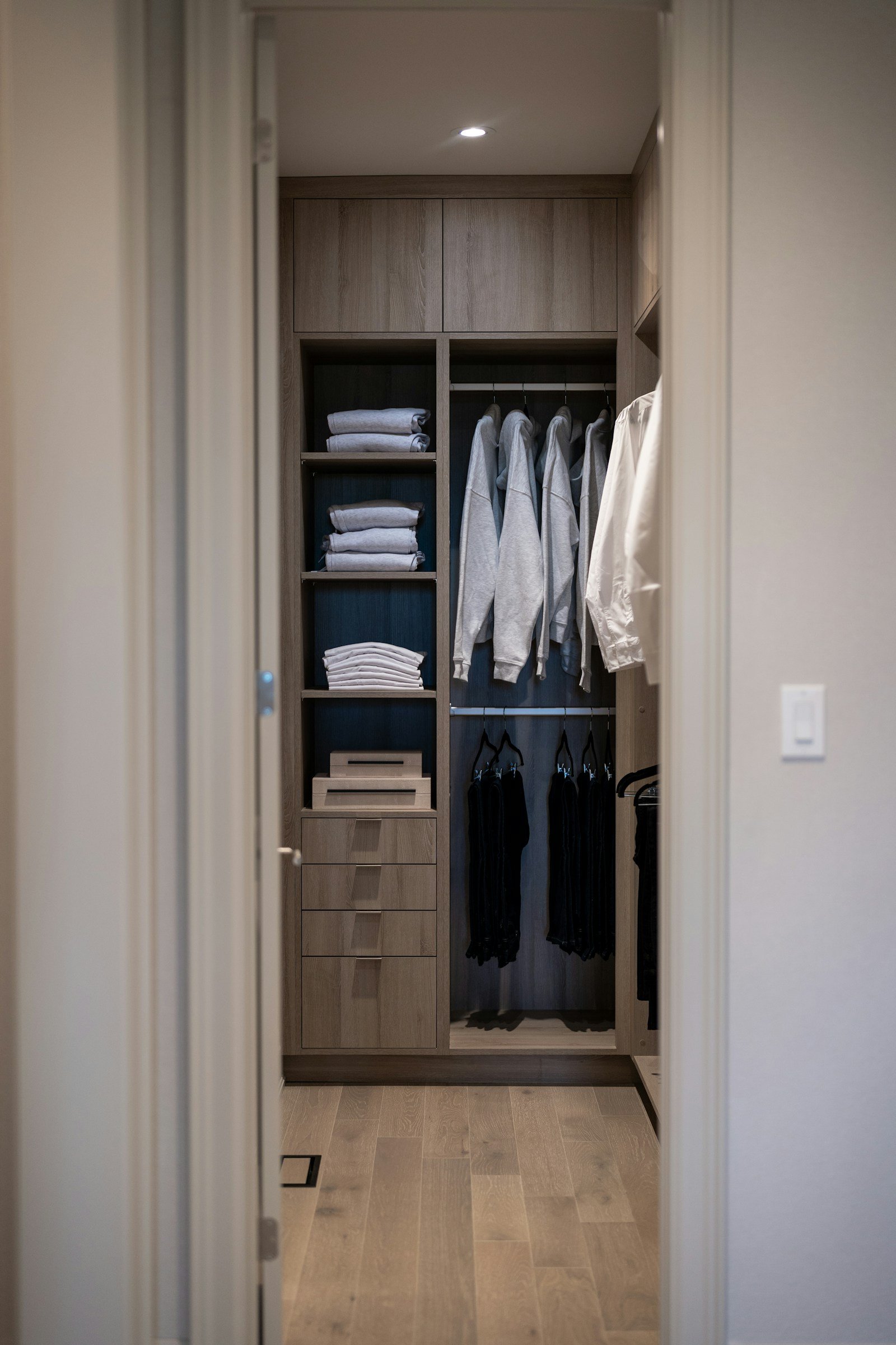Reach-in closet system with double hanging, shelves and drawers